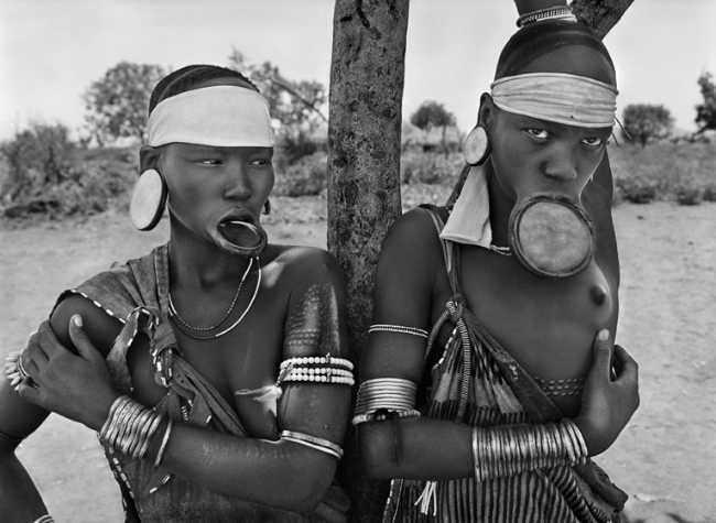 Sebastião Salgado, Mursi village of Dargui in Mago National Park, near Jinka, Ethiopia (two women with lip plates), 2007, Gelatin silver print, 50 x 60 cm/20 x 24 inches © Sebastião Salgado/Amazonas Images
