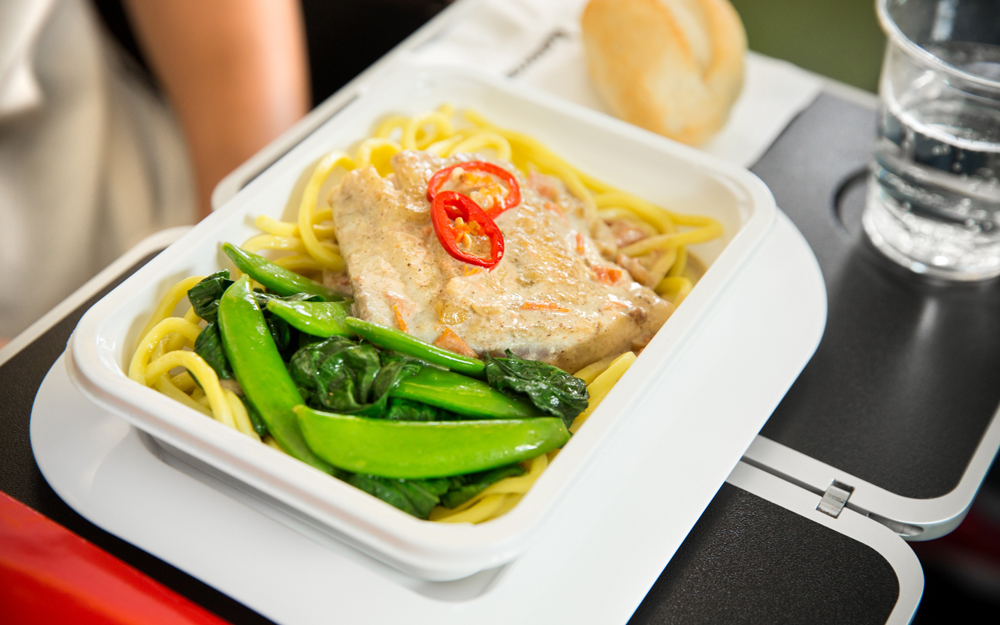 Barramundi poached in a lightly spiced coconut sauce with noodles, sugar snaps, choy sum and chilli[3]