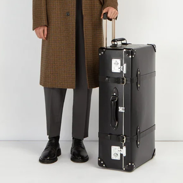 essential travel items Globe trotter luggage