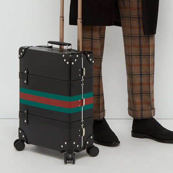 essential travel items gucci x globe trotter luggage