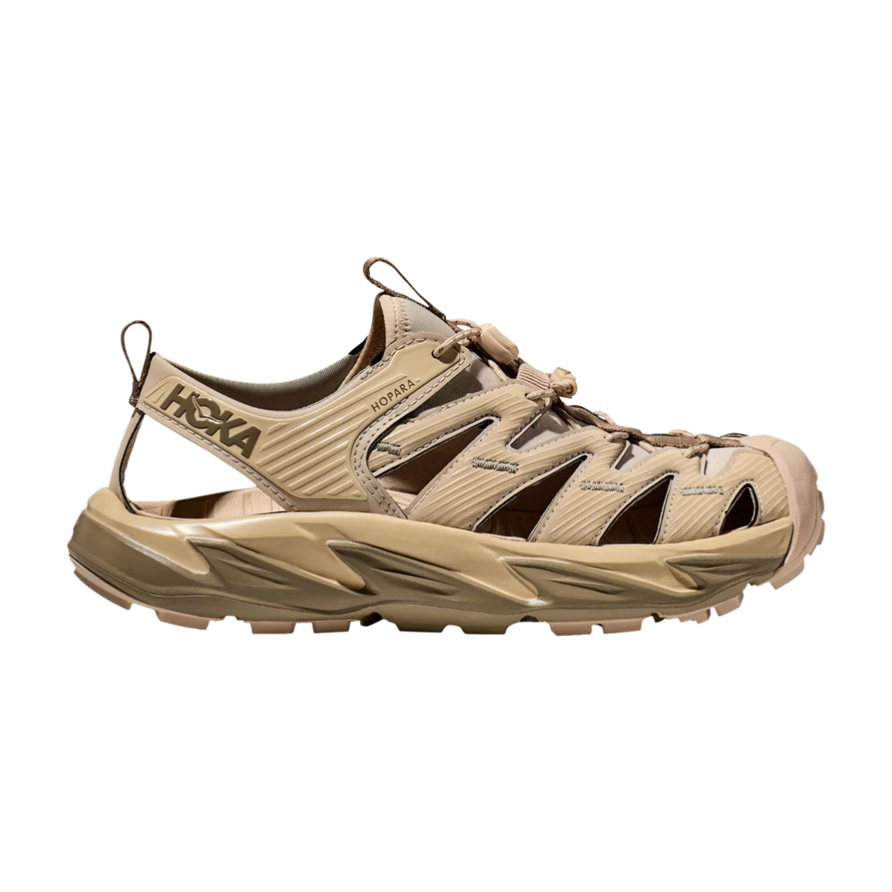 The Hopara Sandal 'Shifting Sand Dune', a sneaker by Hoka, which is a brand that has gained much popularity in recent years.